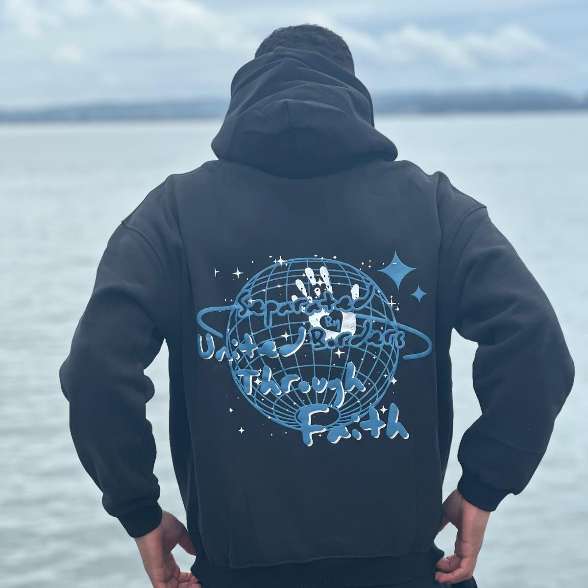 Separated By Borders United Through Faith Hoodie