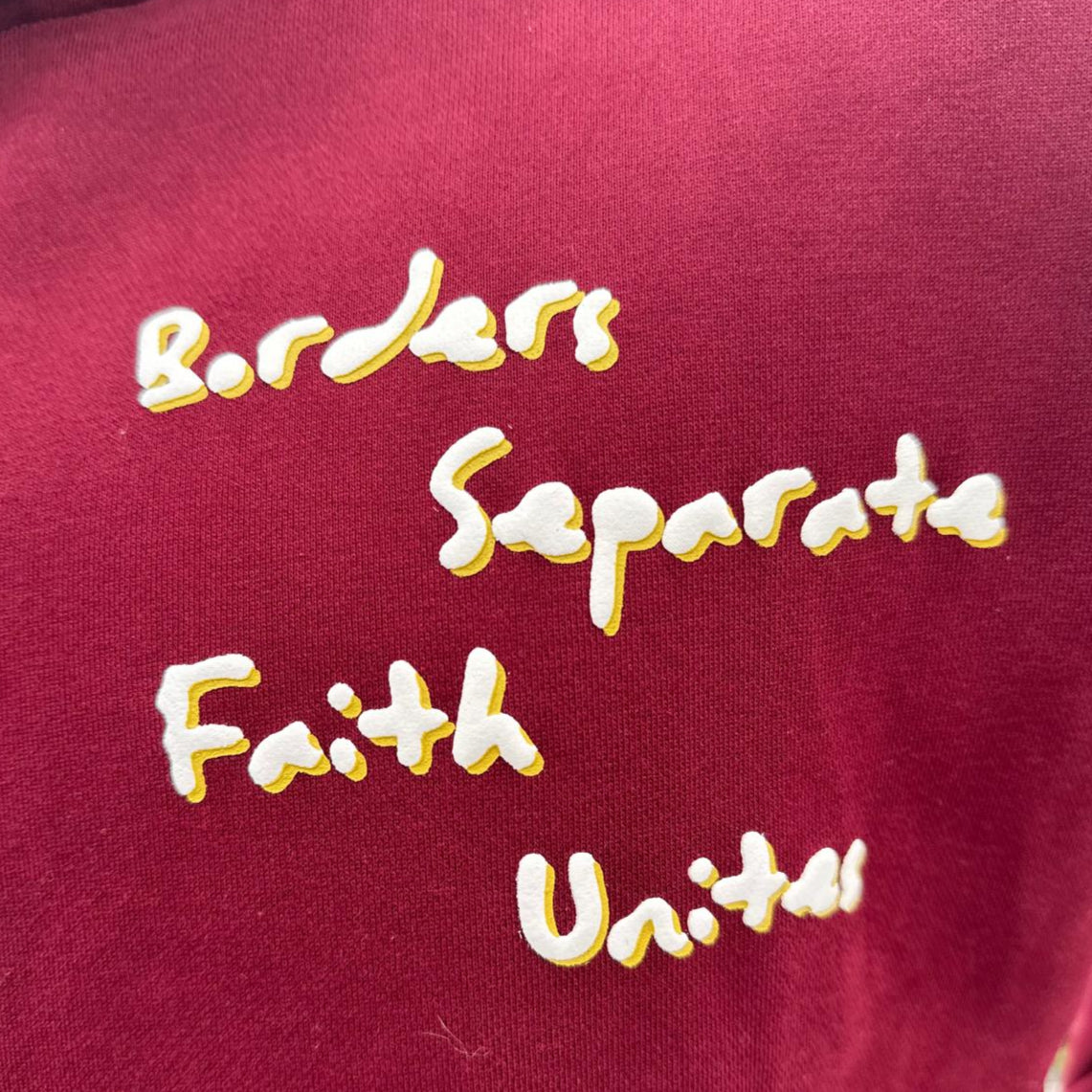 Separated By Borders United Through Faith Hoodie